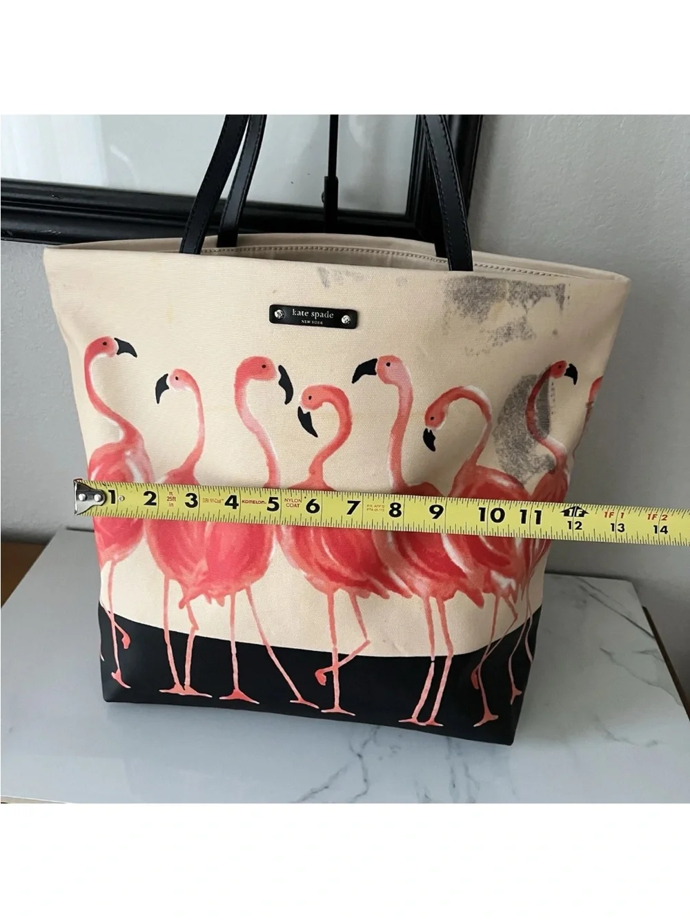 Canvas Flamingo Tote Bag with Black Trim see all pictures. It has black marks.